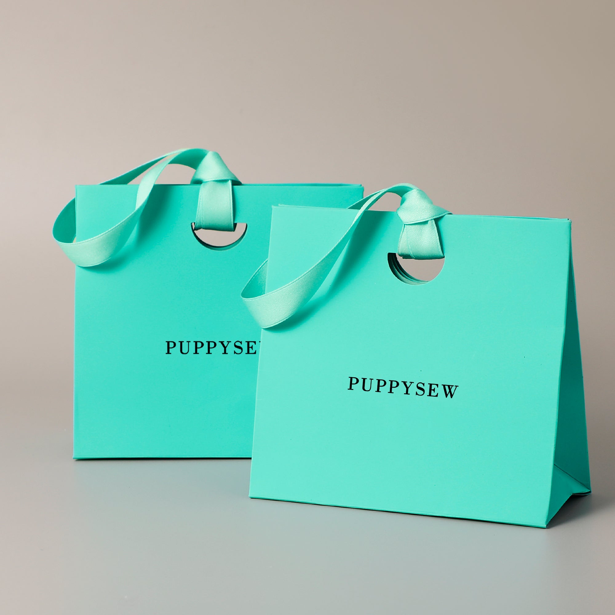 Premium paper gift bags with satin handles, perfect for wedding favors and boutique packaging.-zoom-8